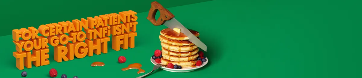 Image of saw cutting through pancakes with various fruits and syrup surrounding the plate.