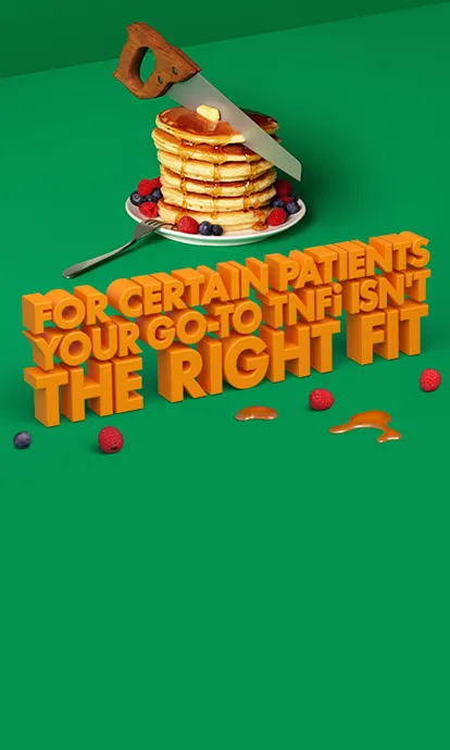Image of saw cutting through pancakes with various fruits and syrup surrounding the plate.